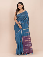 KAVVYA BLUE & RAW SILK BODY PLAIN WITH TREE MOTIFS ON THE BODY COMES WITH CONTRAST PURPLE PALLU WITH PURPLE COLOUR BLOUSE .